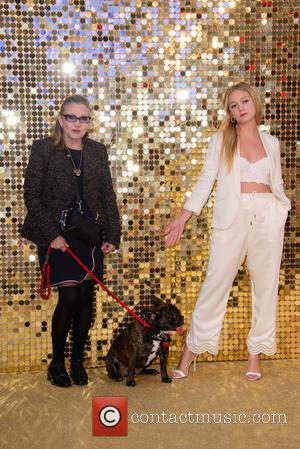 Carrie Fisher with her daughter Billie Lourd and her dog Gary at the premiere of 'Absolutely Fabulous: The Movie' held...