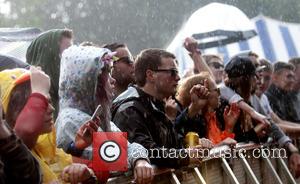 Wet crowds watch bands on the first day of Blissfields 2016 - Winchester, United Kingdom - Friday 1st July 2016