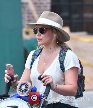 Hilary Duff steps out with her son Luca Cruz Comrie to stroll around the streets of New York City, United...