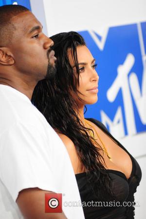 Kanye West posing alone and with Kim Kardashian at the MTV Video Music Awards 2016 held at the Madison Square...