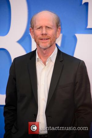 Ron Howard poses alone and with producer Brian Grazer at the world premiere of 'The Beatles: Eight Days A Week...