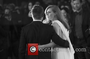 Amy Adams and Jeremy Renner