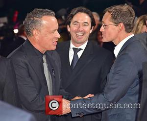 Tom Hanks seen stopping for photos alone and with Rita Wilson at the German Premiere of 'Inferno' held at Cinestar...