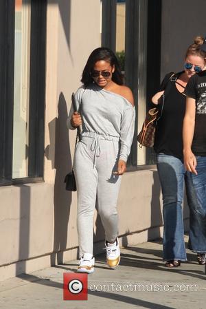 Singer Christina Milian is all smiles whilst out and about shopping on Melrose, West Hollywood, Beverly Hills, California, United States...