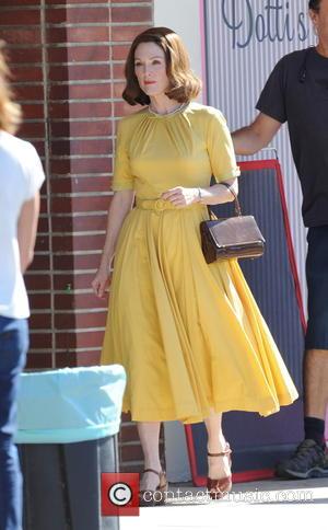 Julianne Moore seen wearing yellow 50's attire on the set of 'Suburbicon'. The film has been written by the Coen...