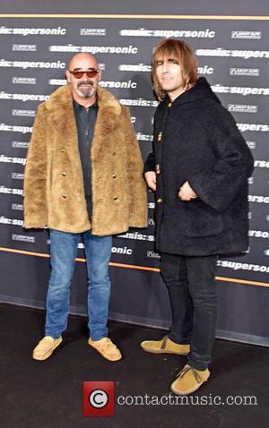 Paul Bonehead Arthurs and Liam Gallagher