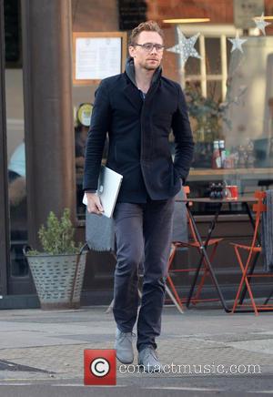 Tom Hiddleston out and about in North London carrying an Apple MacBook. - London, United Kingdom - Wednesday 30th November...