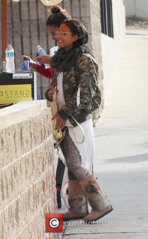 Christina Milian stops at a gas station to fill up her car and buy a bottle of water - Studio...