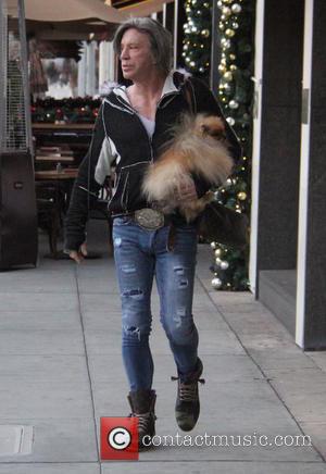 Mickey Rourke leaves Caffe Roma carrying his pet dog in Beverly Hills, Los Angeles, California, United States - Saturday 17th...