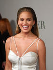 Chrissy Teigen's Tailors Fix Baby Bump Wardrobe Malfunction